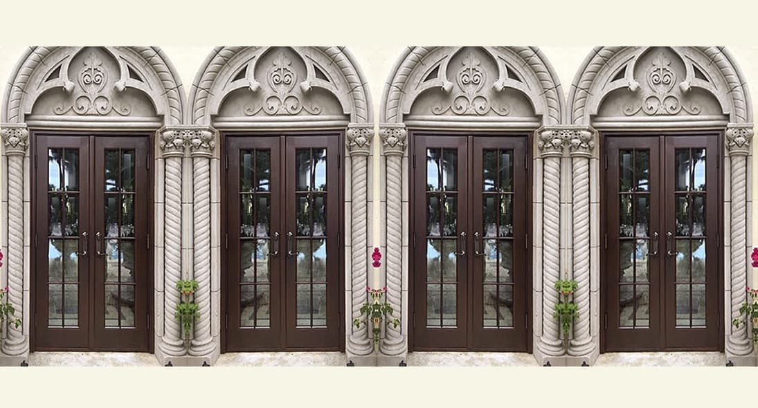 Ornate arched mahogany entry doors